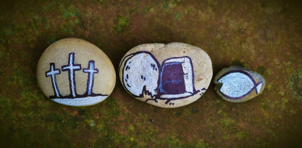 pebble art: three crosses, empty tomb, fish